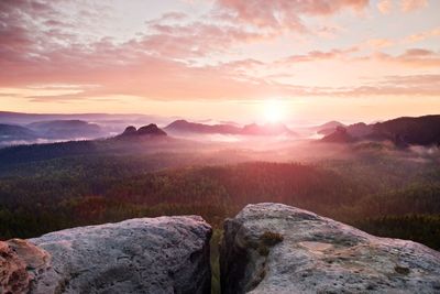 Scenic view of mountains against sky during sunset