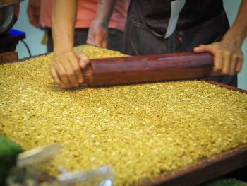 Close-up of people preparing food