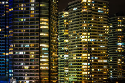 Full frame shot of illuminated buildings in city at night