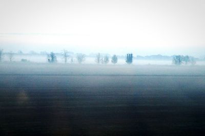 Scenic view of lake in foggy weather