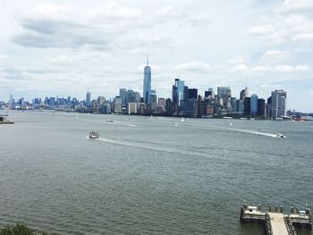 City skyline against cloudy sky