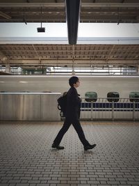 Full length of man walking in city