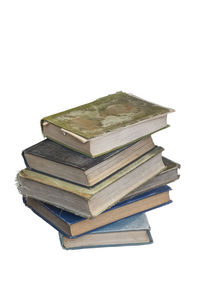 Stack of books against white background