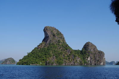 Scenic view of sea against clear blue sky