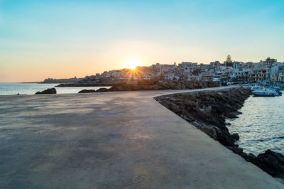 View of beach against sky during sunset