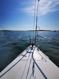 Sailboat sailing on sea against sky