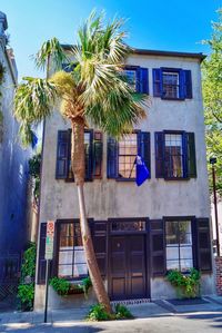 Low angle view of house against blue sky