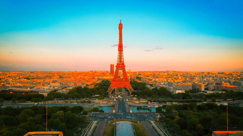 High angle view of illuminated buildings against sky during sunset,eiffel tower, paris. france.