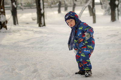 Girl in snow on field during winter