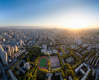 High angle view of cityscape against sky during sunset