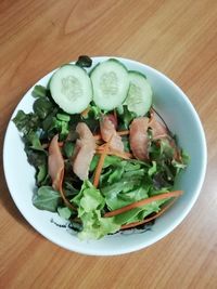 High angle view of chopped vegetables in plate on table