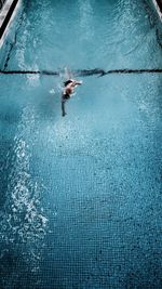 Man swimming in pool