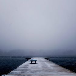 Pier over sea against sky