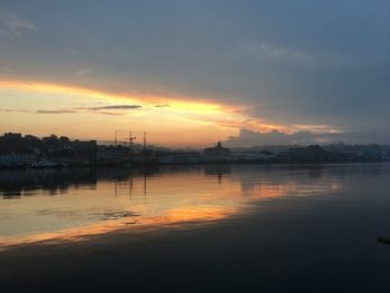 Scenic view of lake against sky during sunset