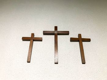 Cross sign on wood against temple