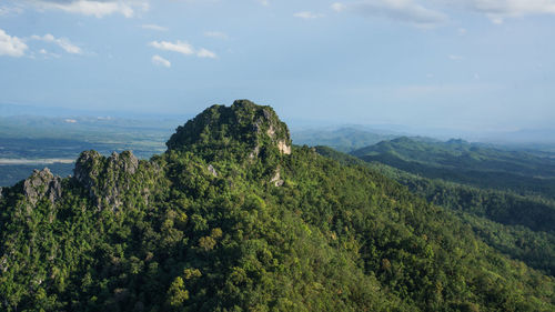 Scenic view of sea and mountains against sky