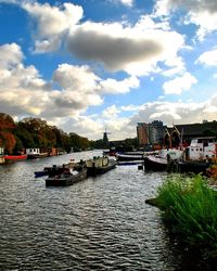 Boats moored at harbor
