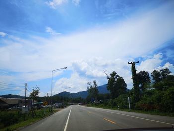 Cars on road against sky