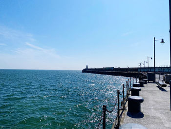 Scenic view of sea against blue sky