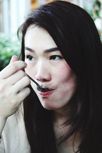 Close-up woman eating food