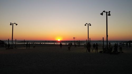 Scenic view of beach against sky during sunset