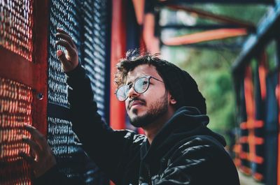 Portrait of young man looking away