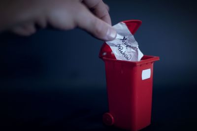 Close-up of hand holding red drink