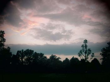 Silhouette trees against sky during sunset