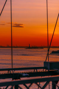 Scenic view of sea against orange sky