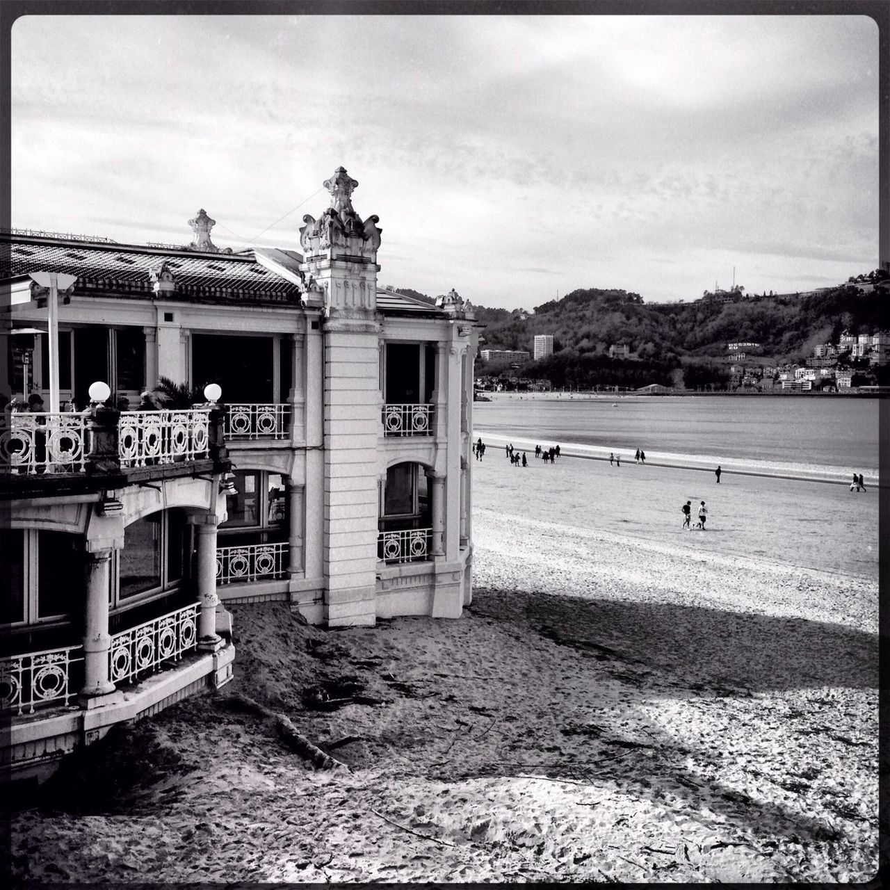 sky, transfer print, architecture, built structure, building exterior, auto post production filter, cloud - sky, water, sea, cloud, cloudy, incidental people, mountain, beach, outdoors, transportation, day, pier, sand, shore