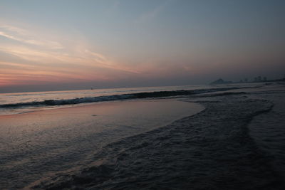 Scenic view of beach against sky during sunset