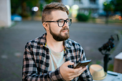 Young man using mobile phone