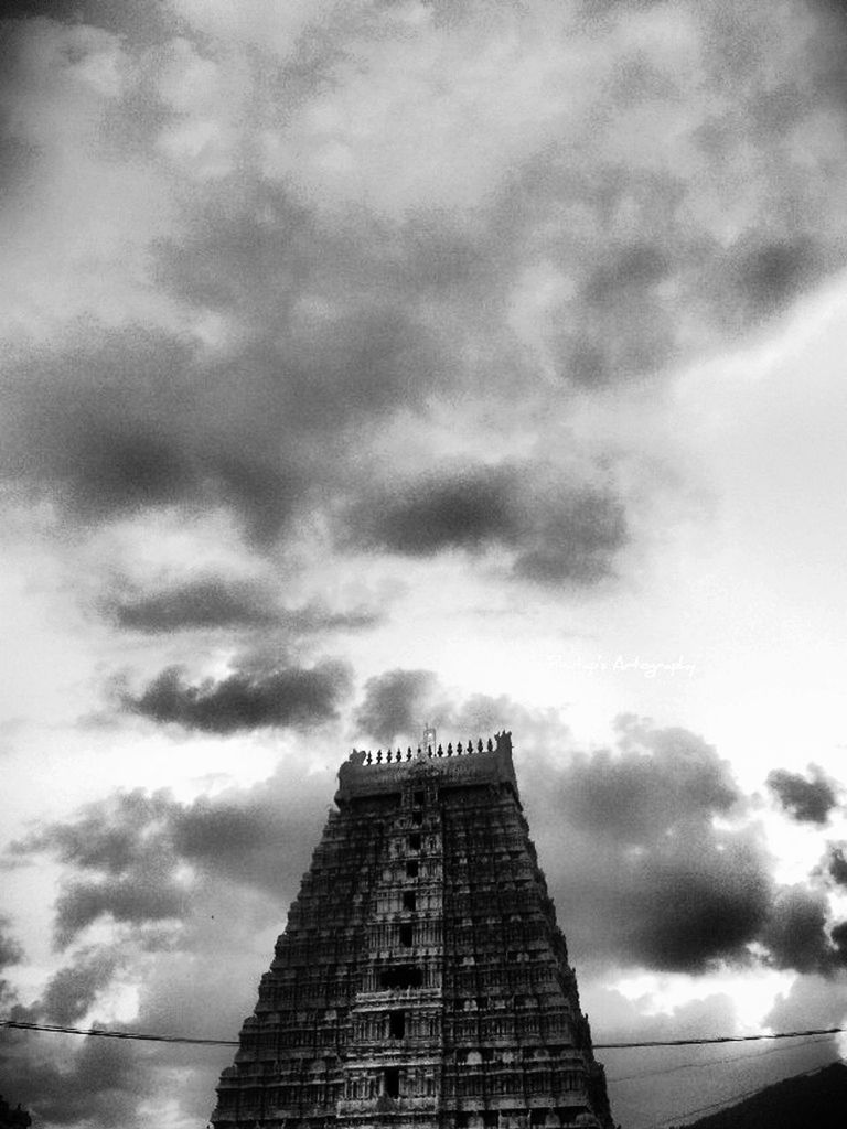 sky, architecture, built structure, low angle view, cloud - sky, cloudy, building exterior, text, cloud, overcast, communication, outdoors, western script, no people, weather, day, guidance, building, city, tower