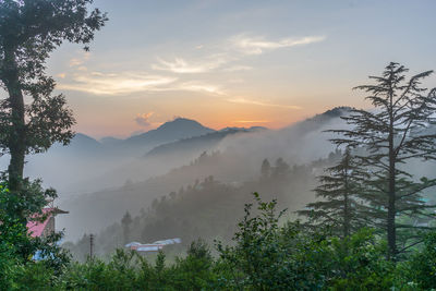 Scenic view of mountains against sky during sunset