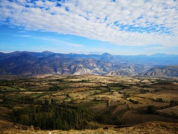 Scenic view of landscape against cloudy sky mountain road