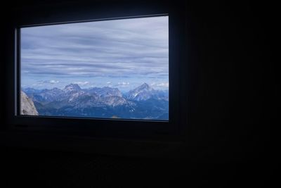 View of mountains through window