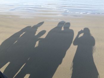 Shadow of people on beach