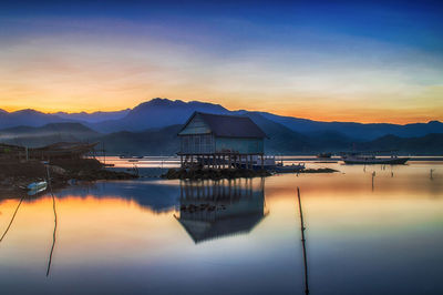 Scenic view of lake against sky during sunset