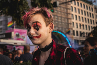 Portrait of handsome young man in city