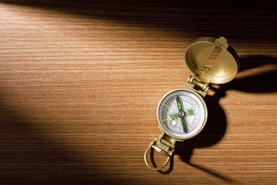 High angle view of clock on table