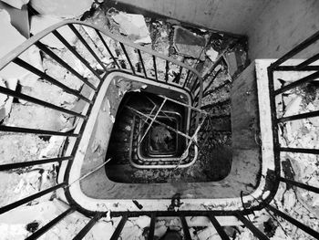 High angle view of spiral staircase in abandoned building