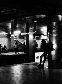 People standing in corridor of building