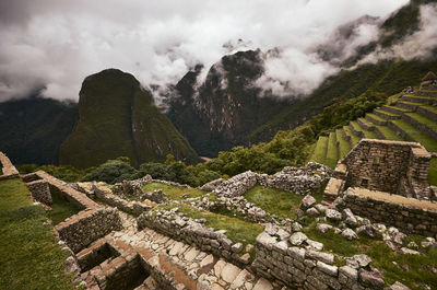 Aerial view of building against cloudy sky