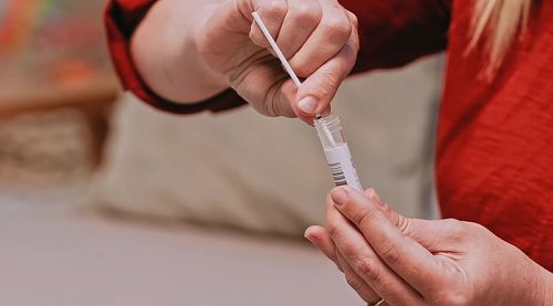 Close-up of hand holding ice cream