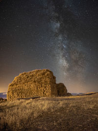 Scenic view of landscape against sky at night