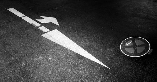 High angle view of arrow symbol on road