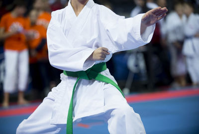 Midsection of man practicing karate 