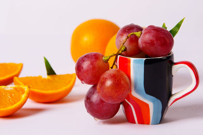 Close-up of fruits in plate on table