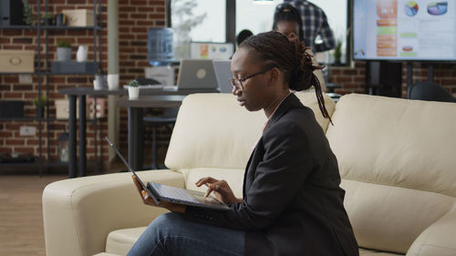 Young woman using laptop