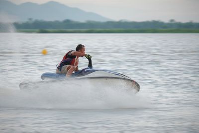 Man in boat on lake